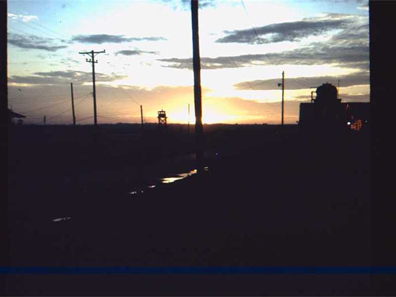 Sunrise at 90th Replacement (Long Binh) just before 2 rockets slammed into morning 
                       assembly area. Luckily no one was in the area at the time.  During the morning assembly
                       the CO spoke to us and said that was “Charlie, welcoming you to NAM.  

